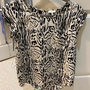 A silk Joie short sleeve blouse in size XS.